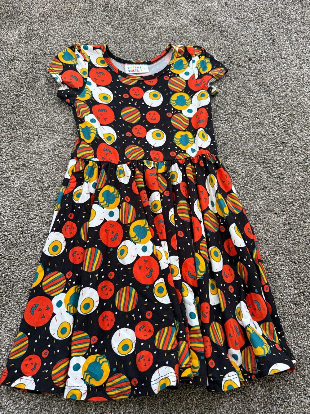 Dot Dot Smile Black Dress with Orange, White and Yellow Planet Print